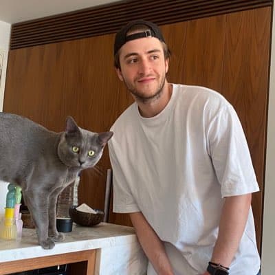 Kourosh Ghaffari with Romeo, the gray cat